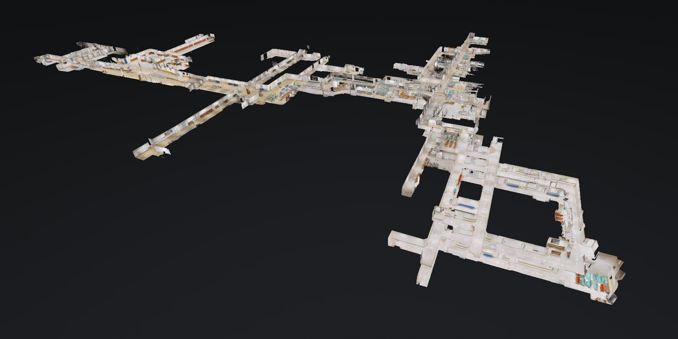 岡山大学病院のデジタルツイン。3Dスキャンで写し取った外来棟の廊下と診察室を、上空から見下ろした立体モデル